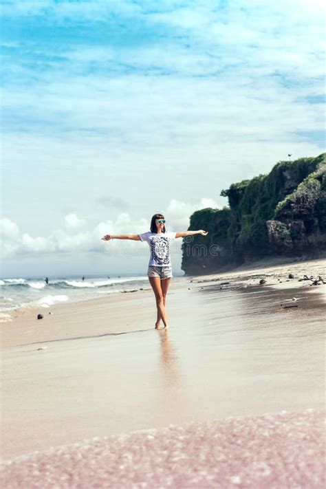 Young Woman Without Bra On The Tropical Beach Of Bali Island Bikini