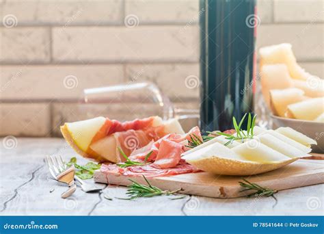 Concept Of Italian Food With Red Wine Melon And Prosciutto Stock Photo