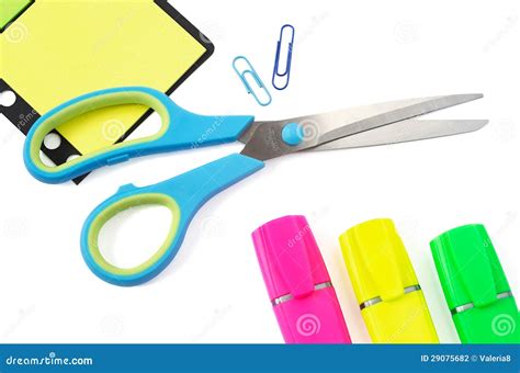 Scissor Paper Clip Stikers And Three Highlighter Pens On White Stock