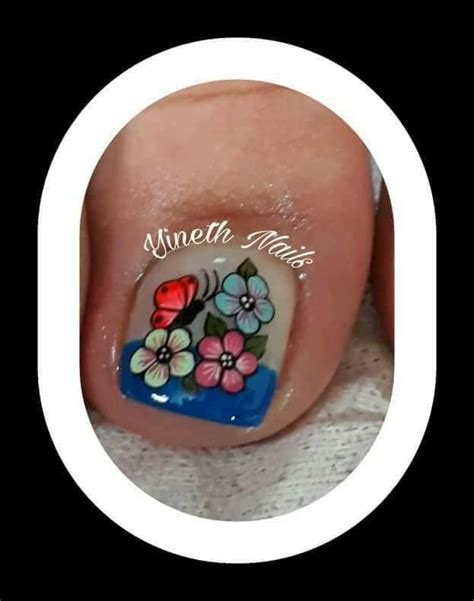 A Mani With Flowers Painted On It