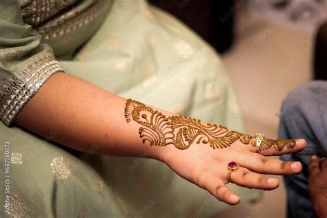 Indian Wedding Mehndi art on hand Stock Photo | Adobe Stock