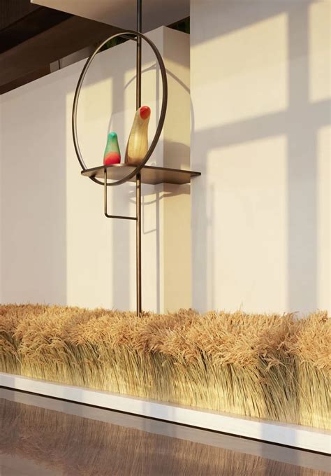 Two Birds Sitting On Top Of A Metal Stand In Front Of A Wall With Hay