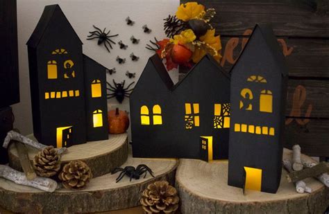 Halloween Decorations Are Displayed On Wood Slices With Pumpkins And