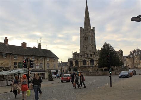 Stamford, Lincolnshire, England - Young people crossing Broad Street after a day of shopping.