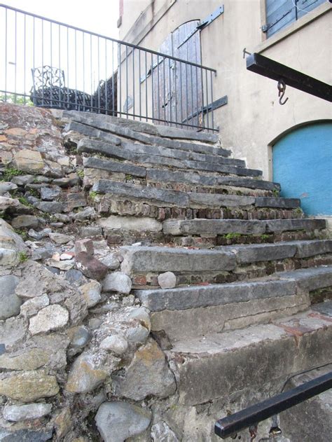 stone steps leading up to a blue door