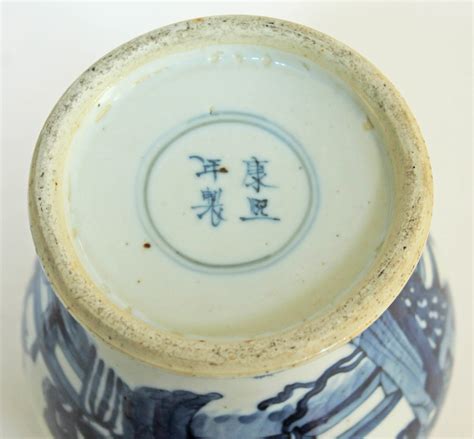 A Chinese Kangxi Style Blue And White Porcelain Vase And Cover Bearing