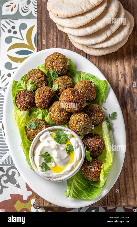 Traditional Homemade Chickpea Falafel Balls With White Sauce And Pita