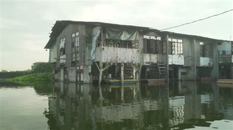 A floating house in the poverty-stricken... | Stock Video | Pond5