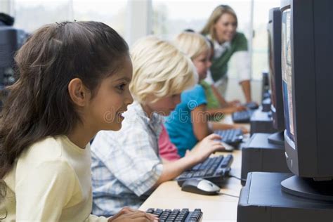 Children Learning How To Use Computer Stock Photo Image Of Colour