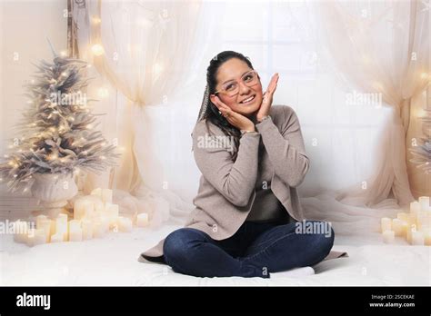 Year Old Latina Brunette Woman With Glasses And Santa Hat Next To