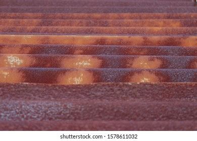 Faded Peeling Rusty Steel Sheets Oxblood Stock Photo