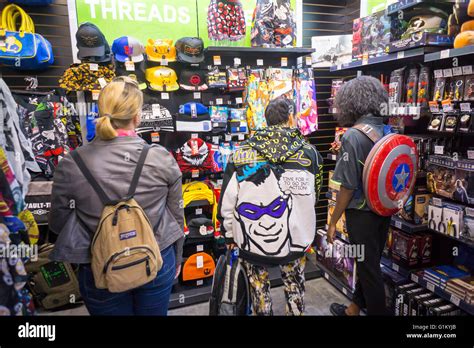 Shoppers browse merchandise at the opening of GameStop's ThinkGeek store in New York on Friday ...