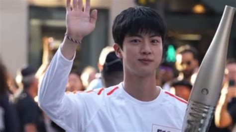 BTS Star Jin Lights Up Paris Olympics Torch Relay BTS Star Jin Lights