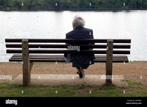 Old Man Sitting Alone On Park Bench Stock Photo Alamy