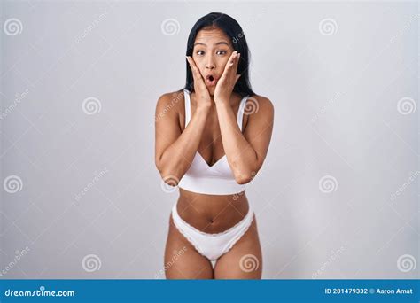 Hispanic Woman Wearing Lingerie Afraid And Shocked Surprise And Amazed