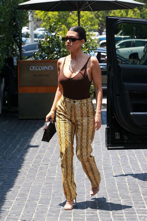 Kourtney Kardashian Rocks A Brown Tank Top And Snakeskin Print Pants As