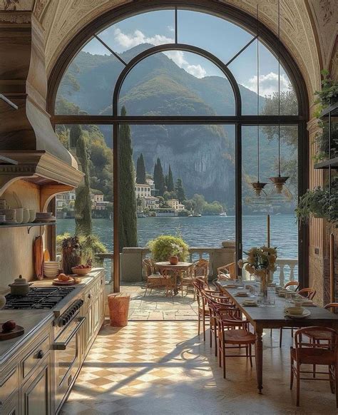 A Large Kitchen With An Arched Window Overlooking The Lake And