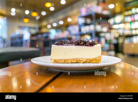 Slice of blueberry cheesecake Stock Photo - Alamy