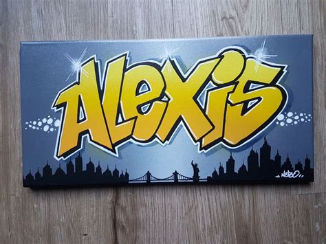 The Name Alexs Is Written In Yellow And Black