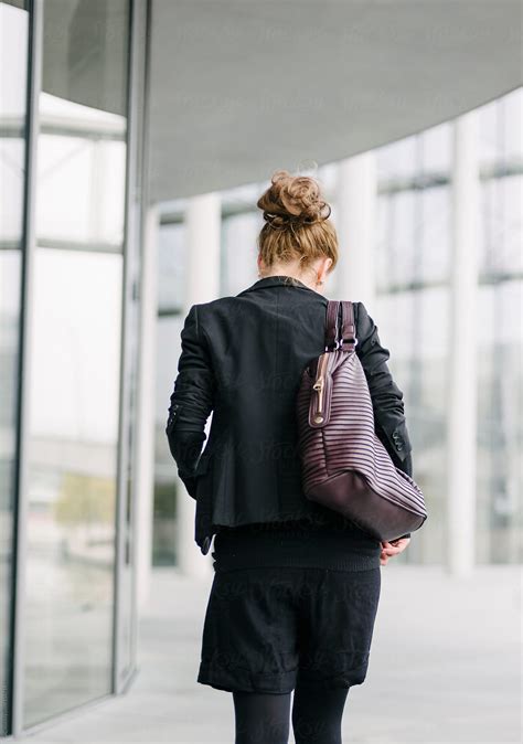 Yuoung Blonde Businesswoman Walking From Behind By Stocksy Contributor Koganami Studio