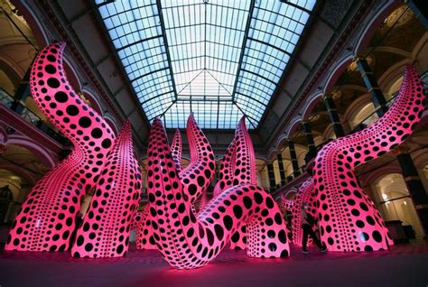 An Art Installation With Pink And Black Polka Dots