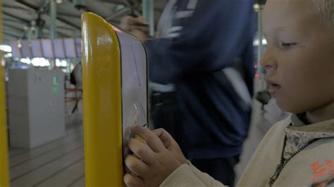 Child using ticket scanning machine 29891448 Stock Video at Vecteezy