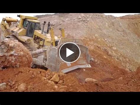 Caterpillar D R Pushing A Massive Rock