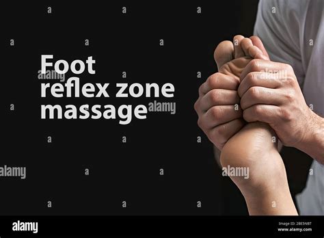 Male Masseur Hands Doing Reflexology Massage On Female Foot Reflex Zones In The Spa Salon Copy