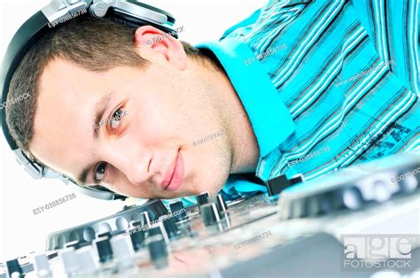 young dj man with headphones and compact disc dj equipment, Stock Photo ...