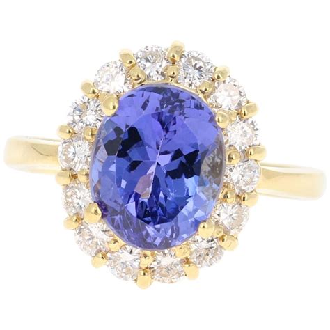 19 57 Carat Natural Tanzanite Cabochon White Diamond 18 Karat Gold