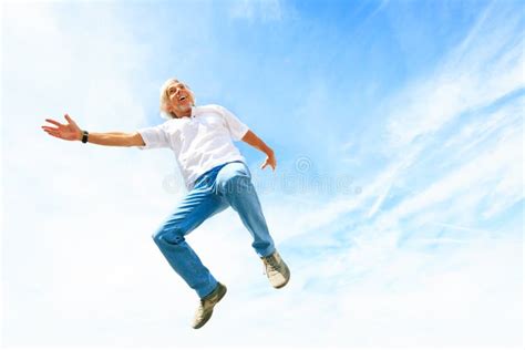 Man In His 50s Jumping High Stock Photo - Image of male, white: 94274220