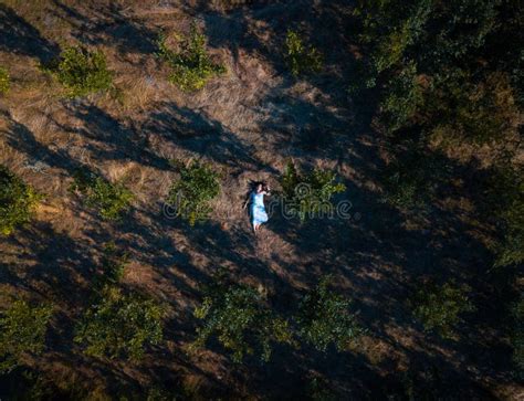 Drone Photo of a Girl Lying in the Grass Stock Photo - Image of ...