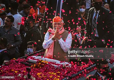 India's Prime Minister Narendra Modi greets crowds of supporters ...