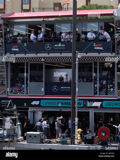 A Vertical Shot Of People In A Building With Mercedes Ads Monaco Grand