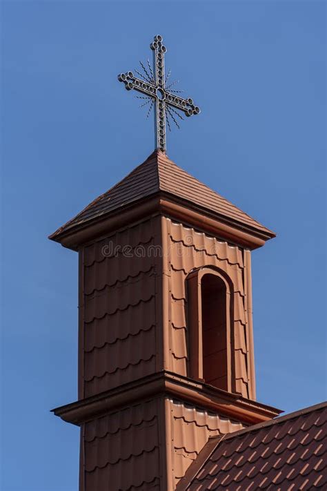 Metal Cross With Roof Tiles In The Blue Sky Background Ukraine Stock