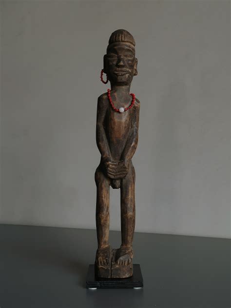 Uncover the Aesthetic Wonders of Nagaland: Wood Male Figures Adorned in ...