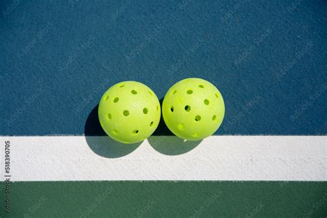 Lime Green Pickleballs on Court Stock Photo | Adobe Stock