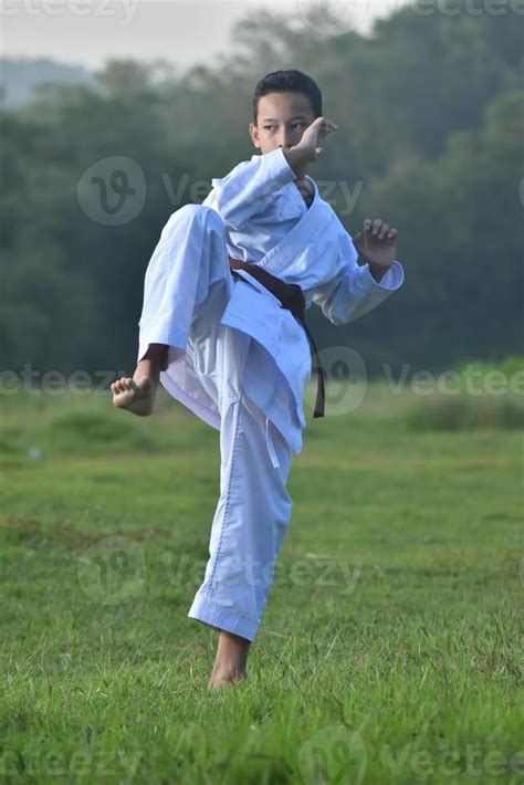 Photo Of A Male Martial Art Person In Kicking Action Pose Photo Of A Karate Guy Doing A【2024】