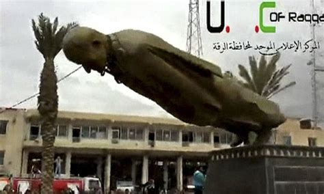 Another One Bites The Bust Syrian Rebels Tear Down Statue Of President