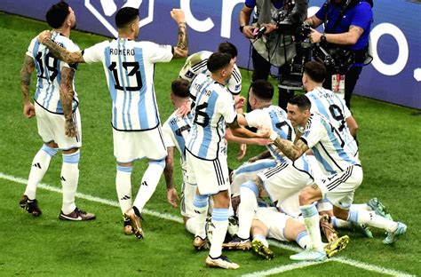 :Lusail:Argentina's Lionel Messi, celebrates with teammates after ...