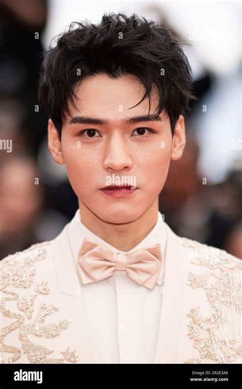 Gong Jun Poses For Photographers Upon Arrival At The Premiere Of The