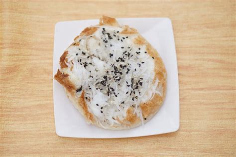 Thai Traditional Soft Bread Stuffed With Coconut Sliced And Sesame