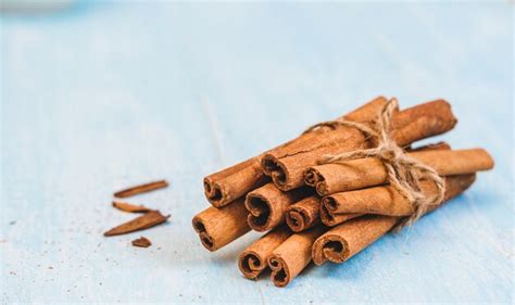 Premium Photo Ground Cinnamon Sticks Tied With Jute Rope On Old