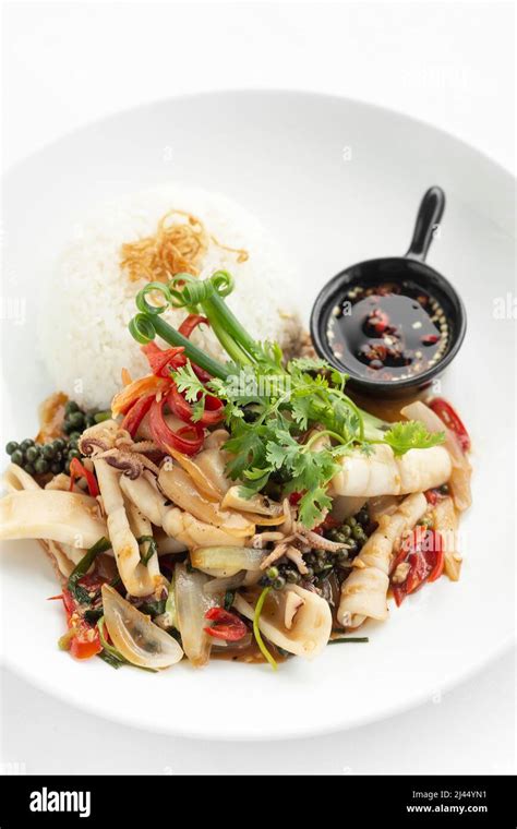 Stir Fry Seafood Spicy Squid With Fresh Green Kampot Pepper In Cambodia