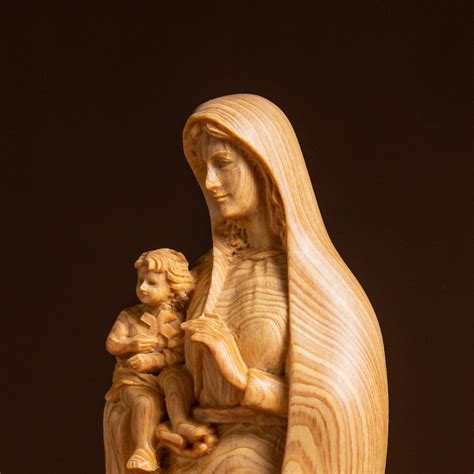 Handcrafted Virgin Mary And Baby Jesus Wooden Statue A Symbol Of Love