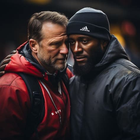 Premium Photo | American football An emotional moment between a coach ...