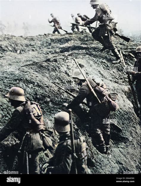 German soldiers attacking out of a trench during World War I Date: 1914 ...