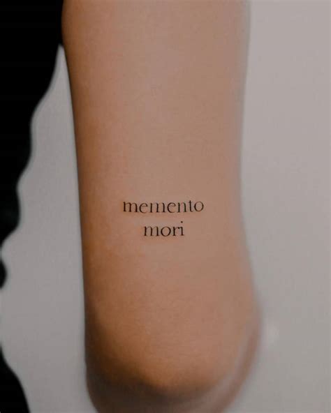 Memento Mori Lettering Tattoo Located On The Tricep