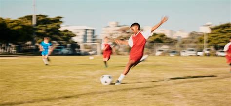 Premium Photo | Sports game soccer and child shooting kick or strike ...