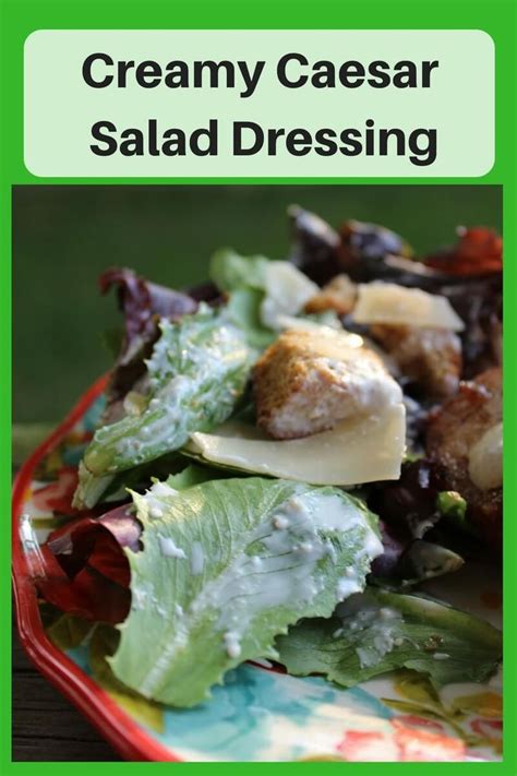 A Close Up Of A Plate Of Food With Salad Dressing On It And The Words Creamy Caesar Salad Dressing